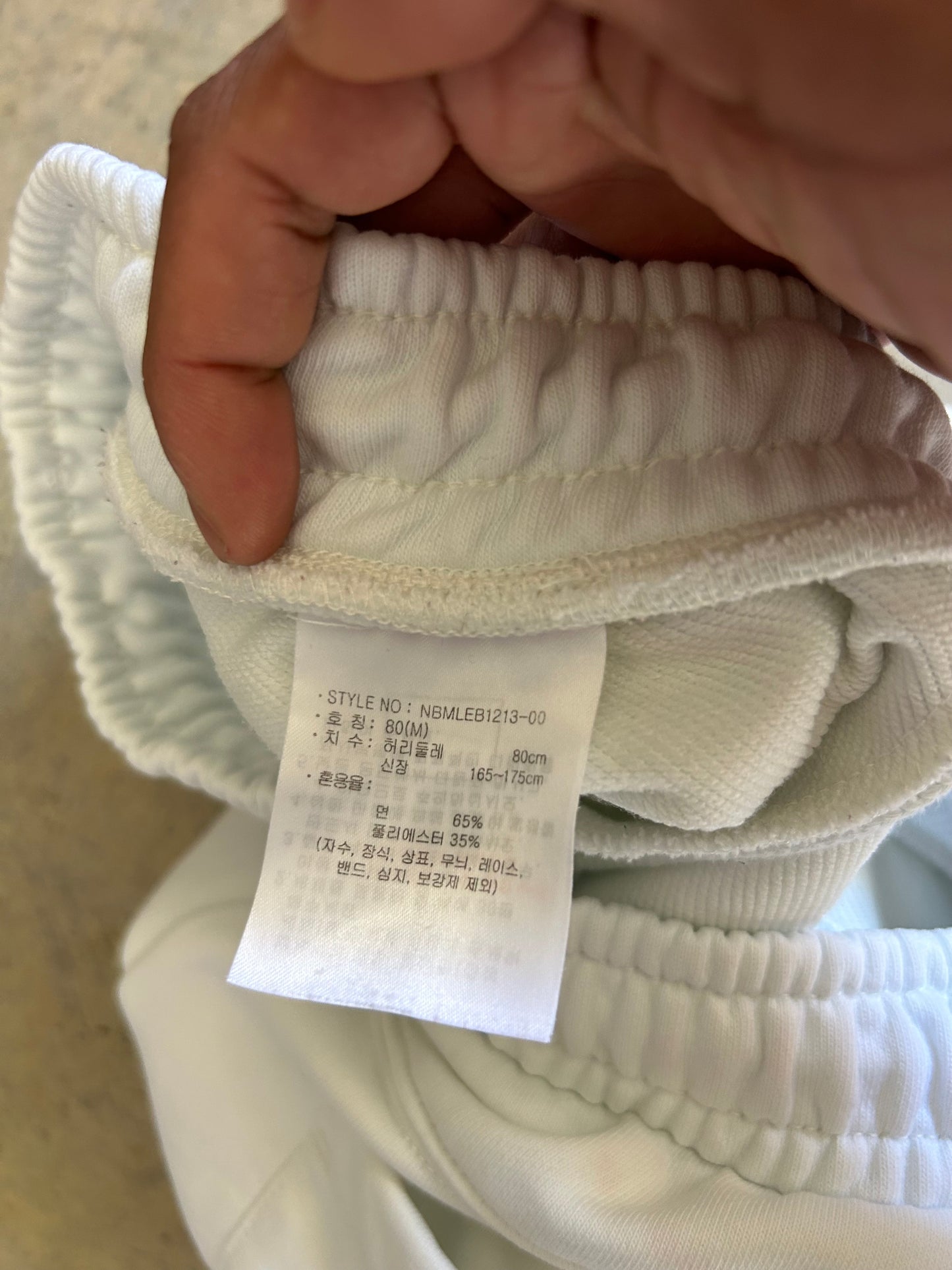 New Balance Essentials Varsity Fleece Sweatpants in a white colorway Medium