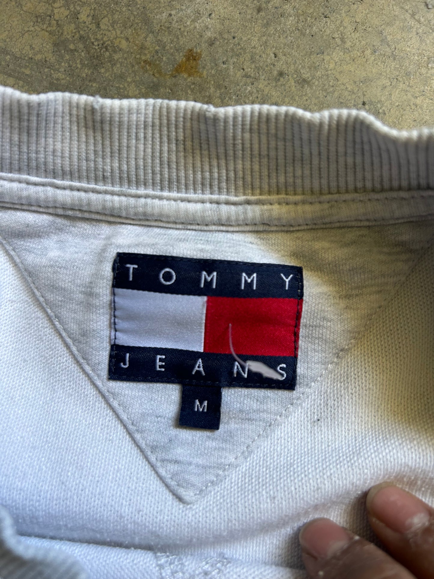 vintage-style Tommy Jeans crewneck sweatshirt features a prominent vertical logo patch on the chest Large