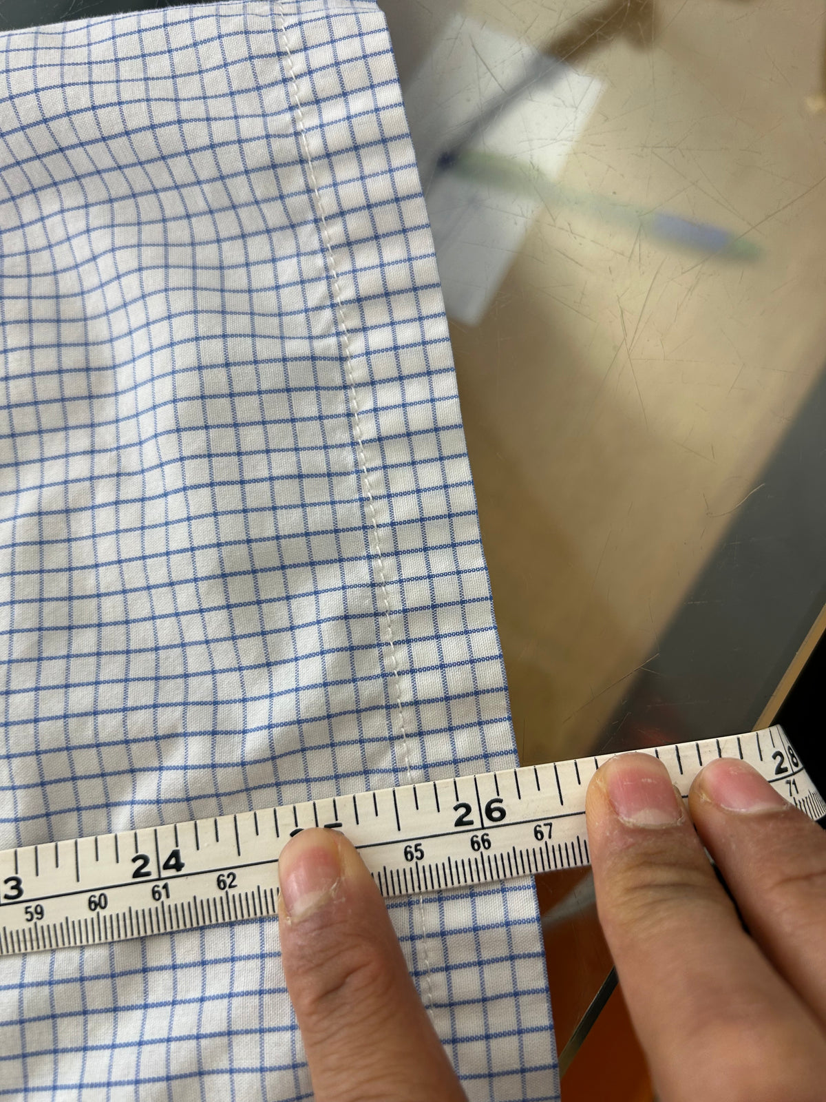 Vintage light blue and white grid-check (graph-check) short-sleeve button-down shirt by Polo Jeans Co. / Ralph Lauren featuring a small dark pony logo embroidered on the chest pocket.