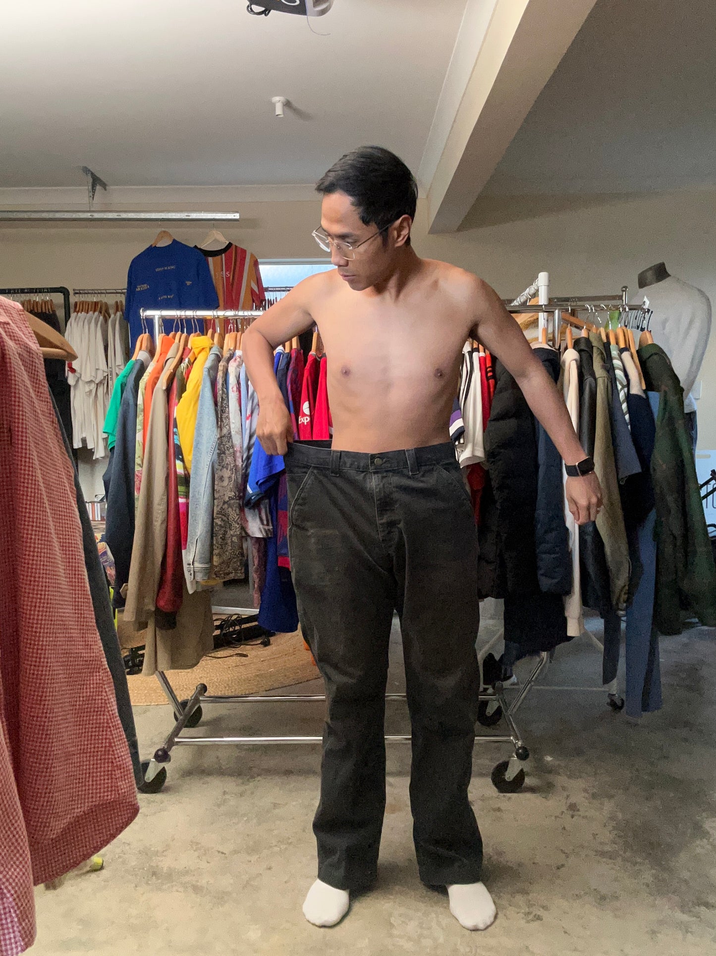 vintage Carhartt Carpenter pants, characterized by a faded black finish and utility features like a hammer loop size 36