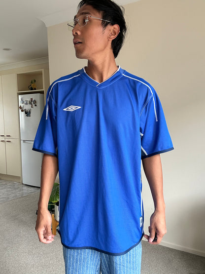 vibrant blue Umbro performance jersey featuring a V-neck design and white piping details XL