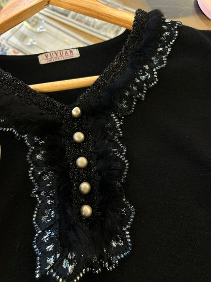 Yuyuan black long-sleeve sweater features a V-neckline adorned with delicate lace trim and pearl-like button details