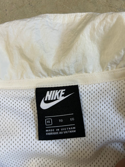 Nike Big Swoosh Woven Statement Jacket, often referred to as a windbreaker, which features a prominent large swoosh design XL White