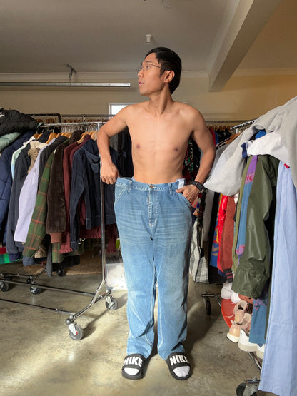 Carhartt WIP Simple Pants are rendered in a light blue stone-washed denim featuring the iconic square logo patch on the back pocket.Size 34