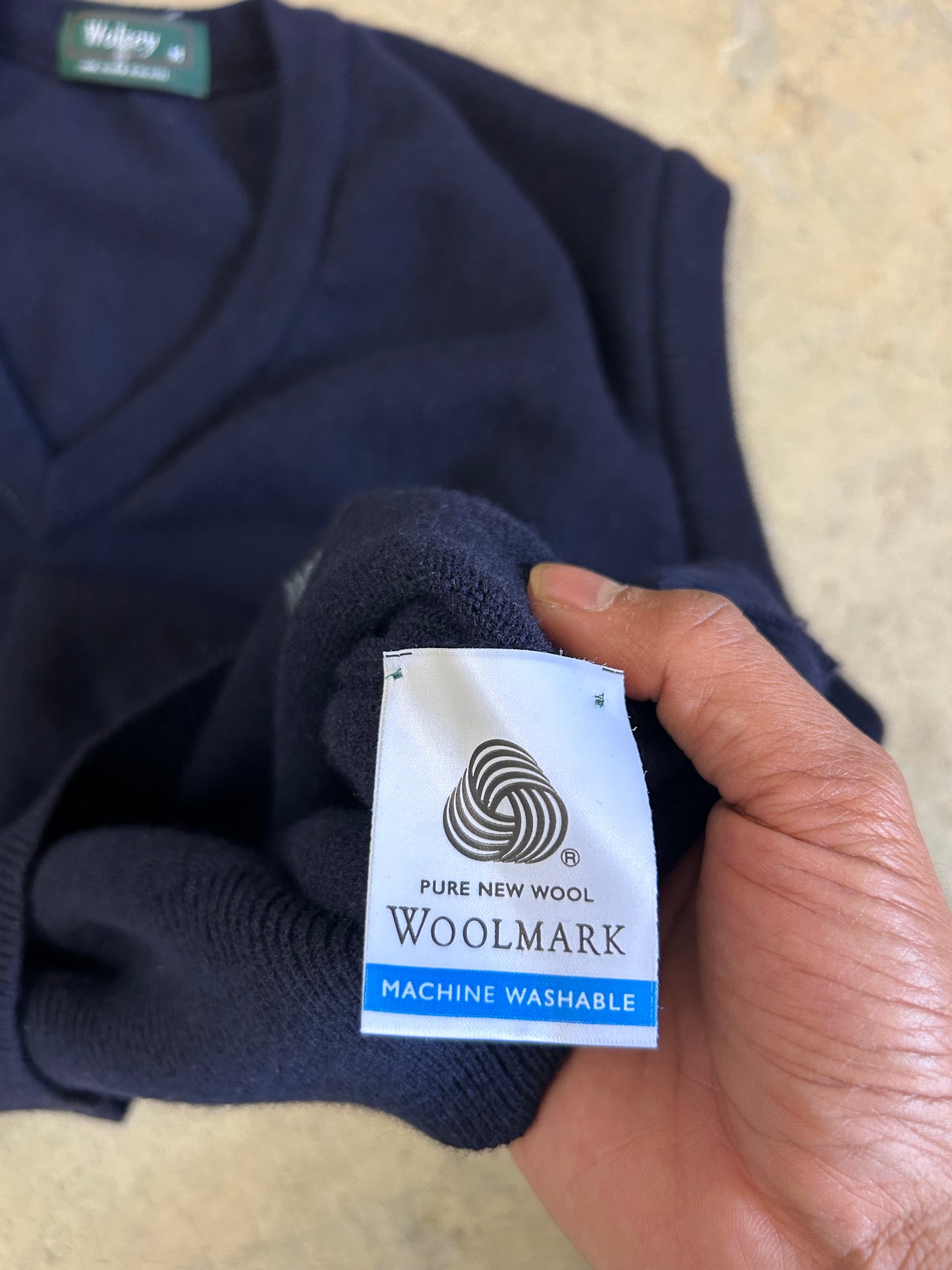 navy blue knitted v-neck vest is a vintage Wolsey brand garment made in New Zealand Medium
