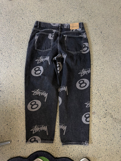 black Stüssy Stock 8 Big OL Jeans featuring an all-over washed graphic print of the brand's iconic 8-ball and stock logo 34