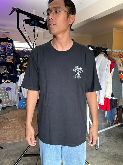 Stüssy Skull & Bones Pigment Dyed T-shirt in black, featuring a screen-printed graphic on the back XL