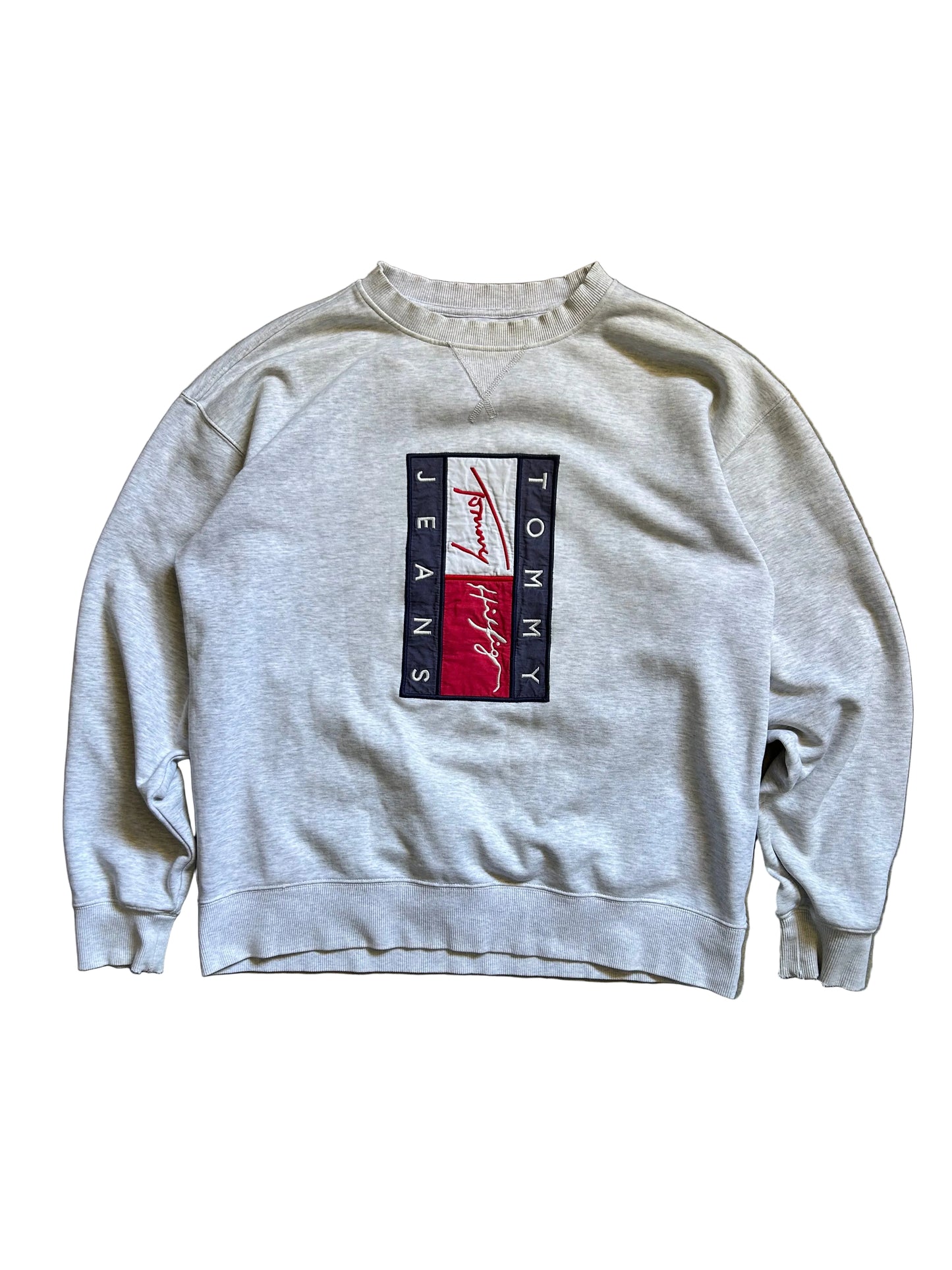 vintage-style Tommy Jeans crewneck sweatshirt features a prominent vertical logo patch on the chest Large