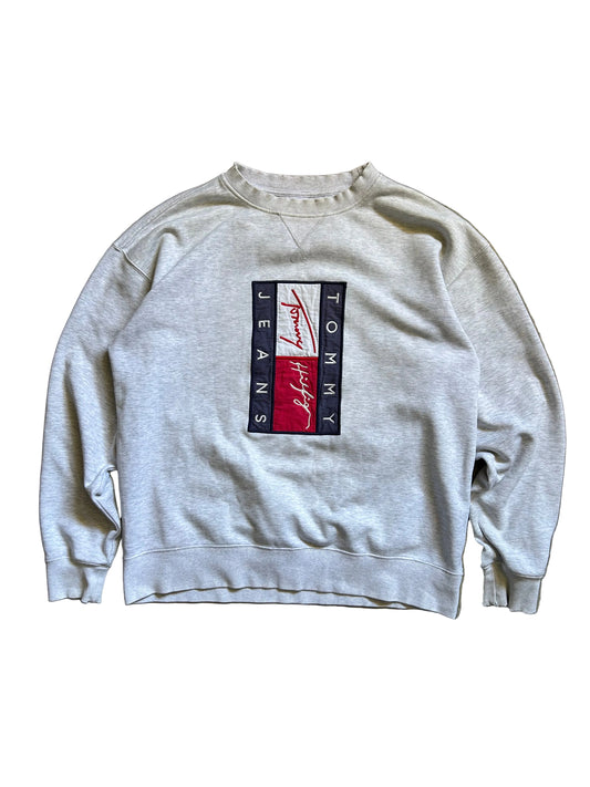 vintage-style Tommy Jeans crewneck sweatshirt features a prominent vertical logo patch on the chest Large