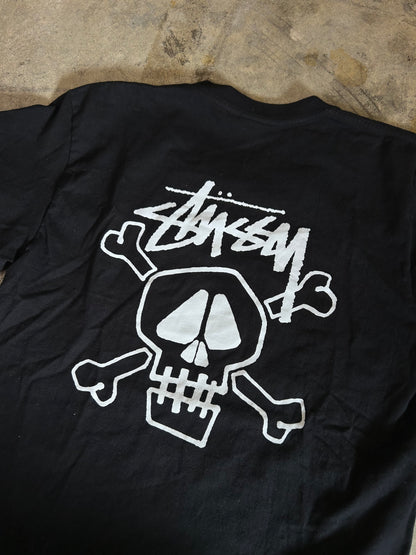 Stüssy Skull & Bones Pigment Dyed T-shirt in black, featuring a screen-printed graphic on the back XL