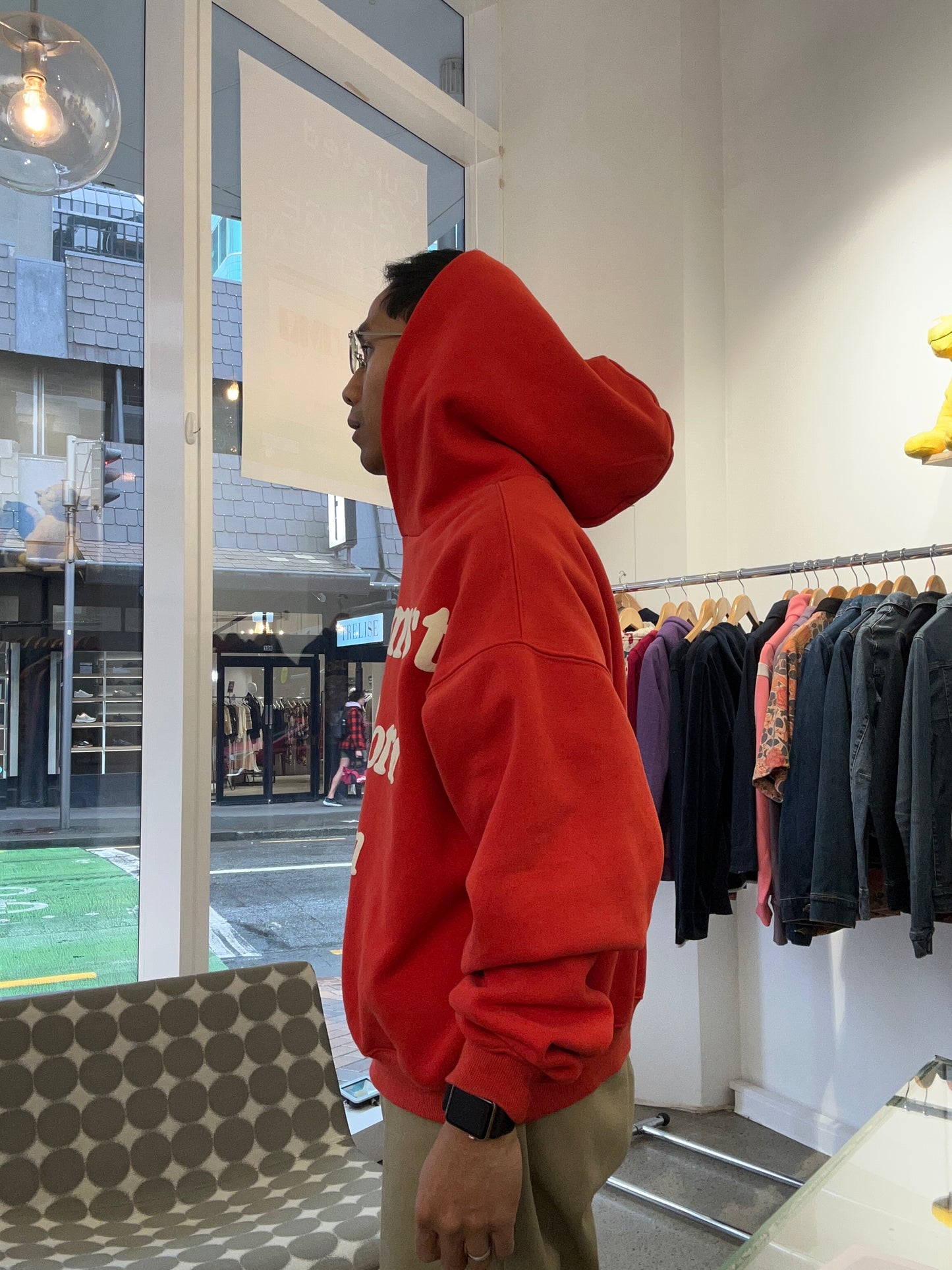 red Cactus Plant Flea Market (CPFM) "Ye Must Be Born Again" hoodie featuring prominent white puff-print lettering across the chest. Medium