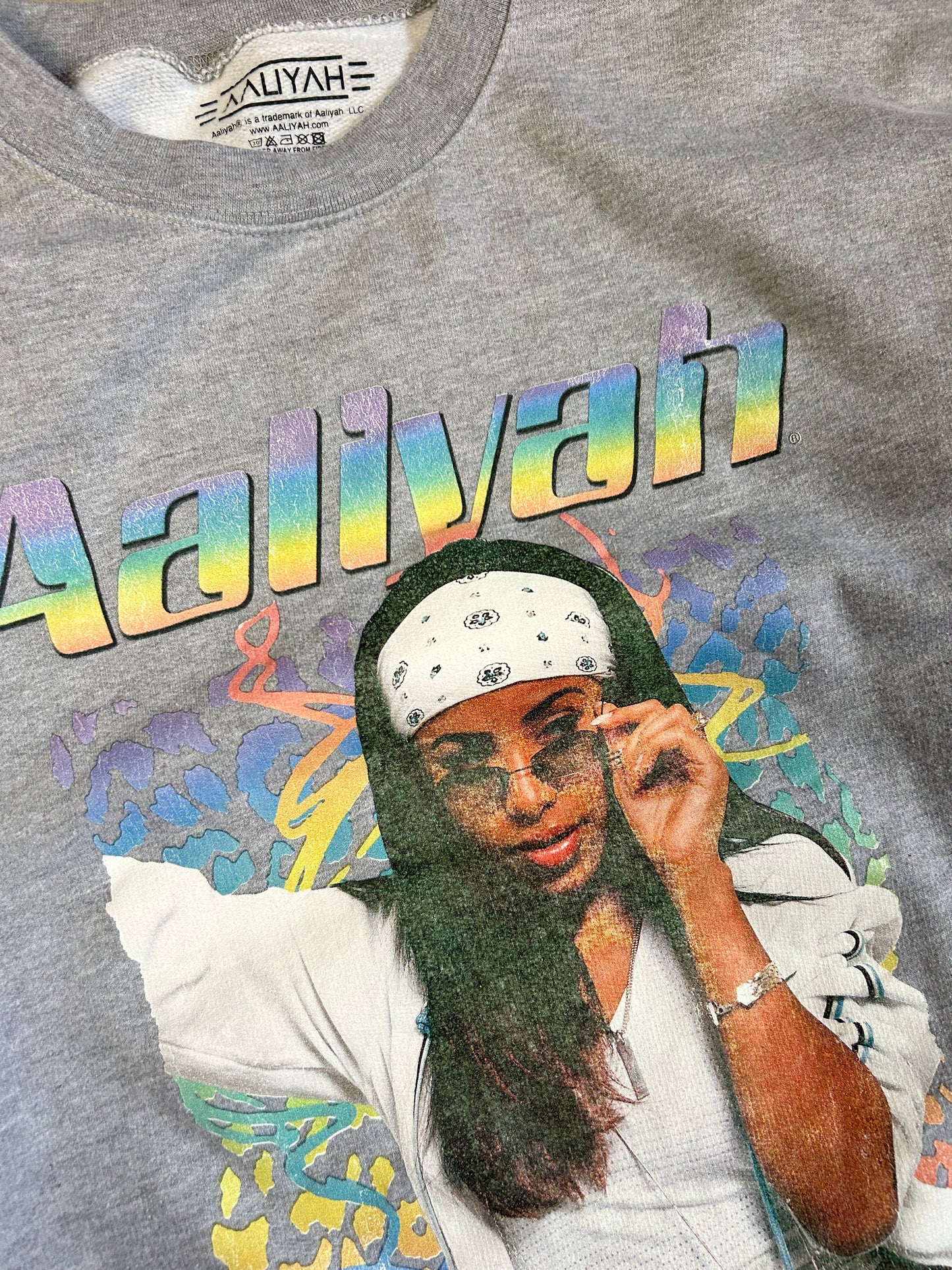 gray crewneck sweatshirt featuring a graphic of the singer Aaliyah Medium
