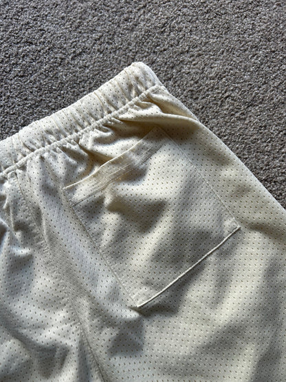 Fear of God Essentials Graphic Mesh Drawstring Shorts
Cream Medium