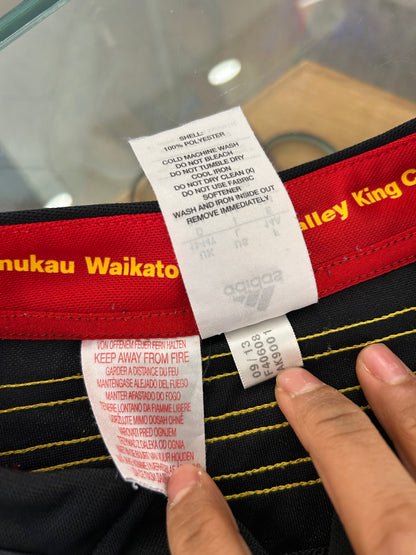 adidas 2014/15 Chiefs Super Rugby home jersey, featuring the prominent black, red, and gold Māori design panels along the sides and the classic bnz sponsor logo across the chest.