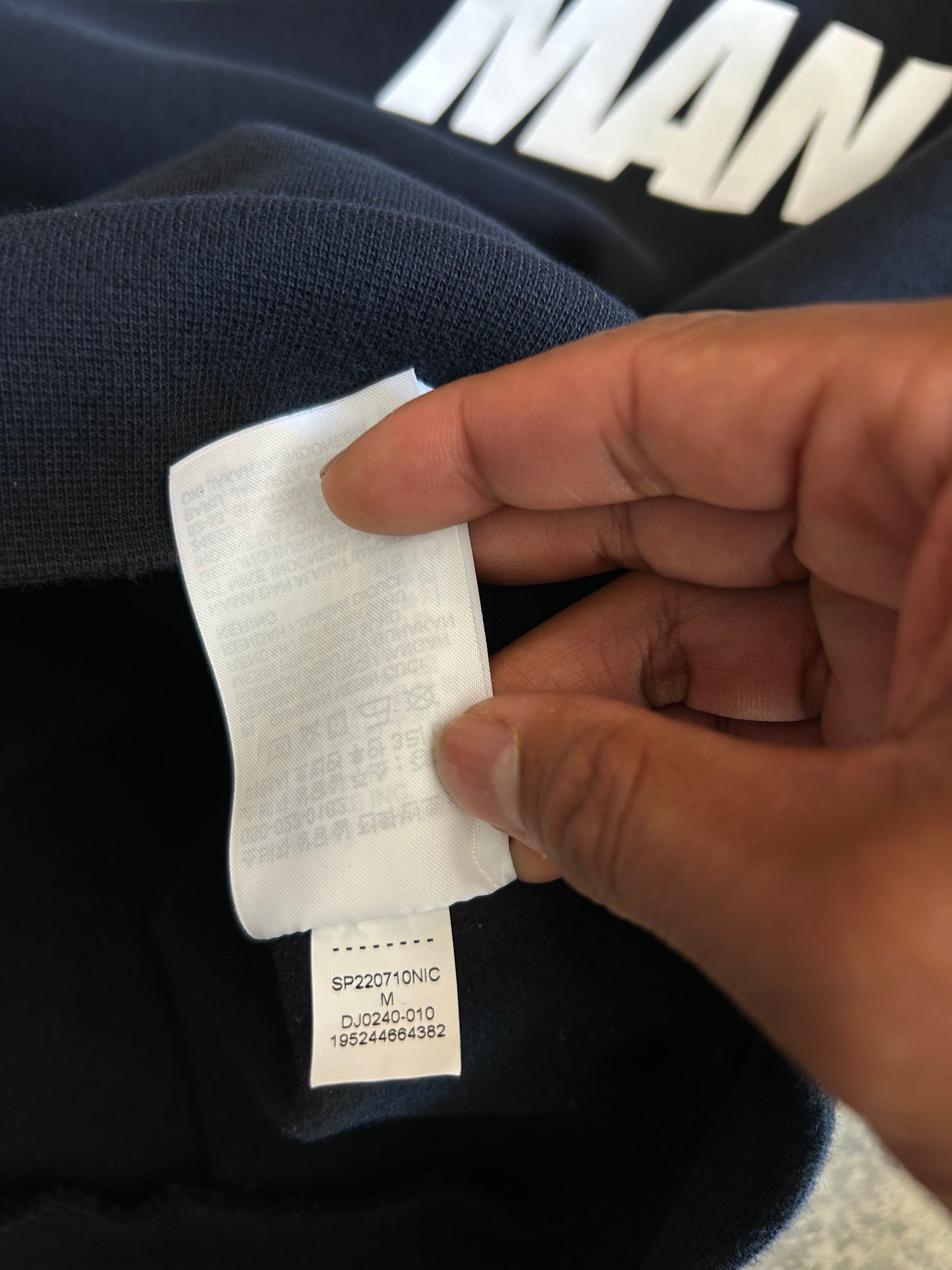 black Jordan Jumpman Men's Fleece Crew Sweatshirt, which features side pockets and a prominent white "JUMPMAN" graphic with the Nike swoosh Medium