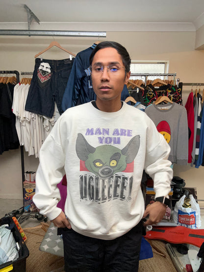 vintage white crewneck sweatshirt features a large graphic of Ed the hyena from The Lion King with the text "MAN ARE YOU UGLEEEE Large