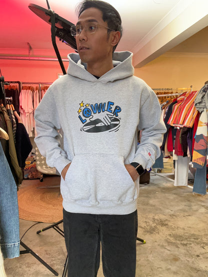 heather grey hoodie from Lower features a central "Lower" graphic of a hand on a vinyl record with star accents Medium