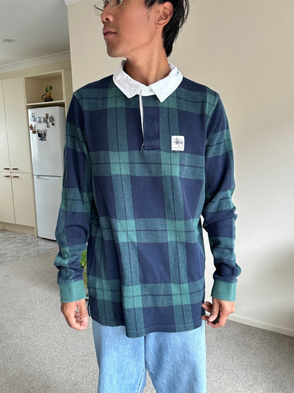 green and navy plaid shirt is the Stussy June Jacquard Rugby Shirt XL