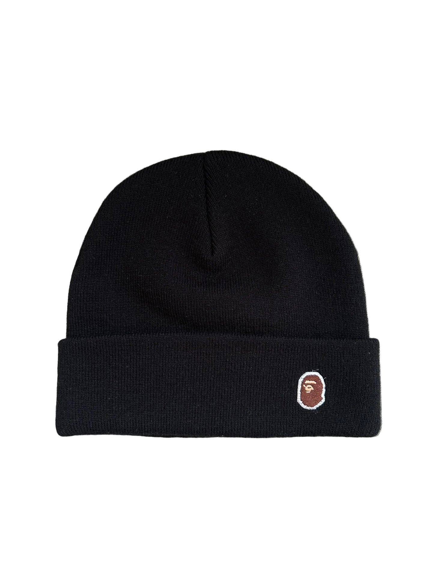 A Bathing Ape BAPE Ape Head One Point Knit Cap in black featuring a rolled brim and an embroidered logo patch