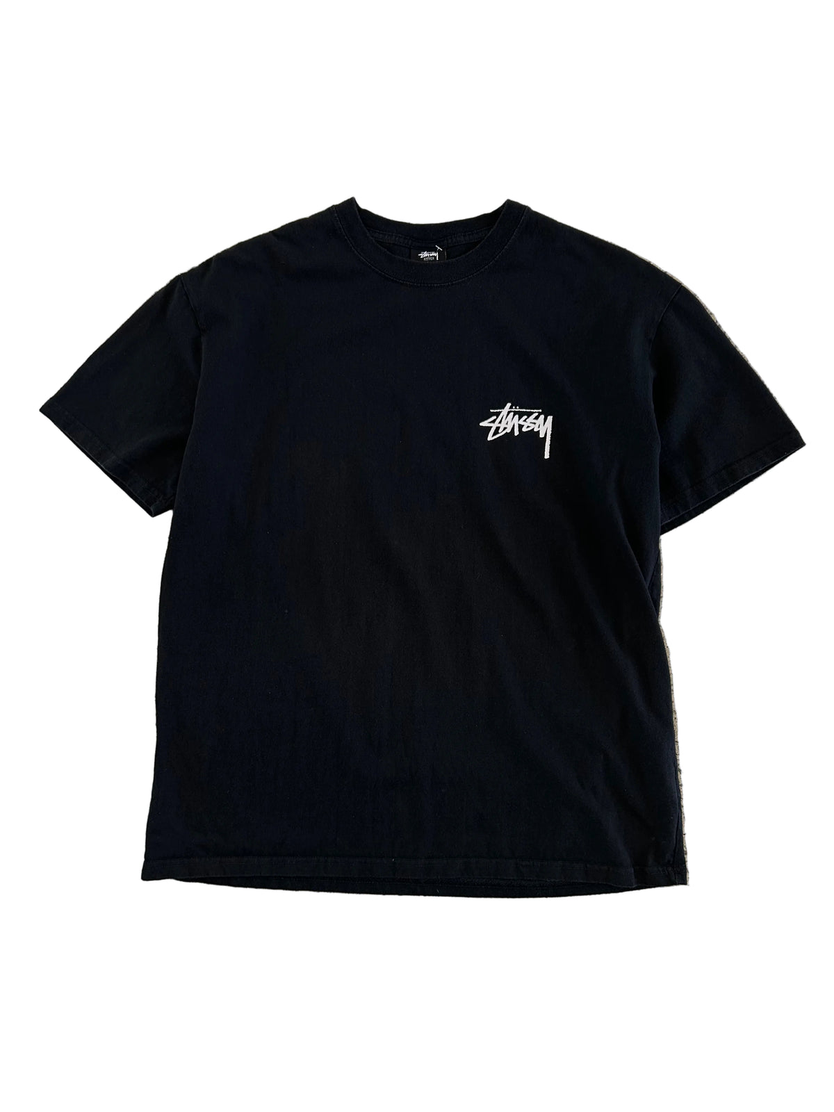 Stüssy Fuzzy Dice Tee in black, featuring a prominent fuzzy dice graphic on the back. Large