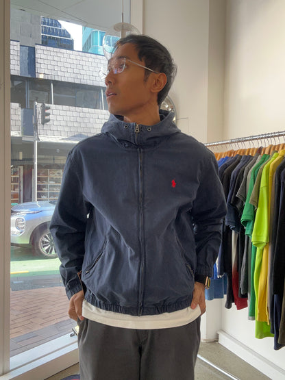 dark blue Polo Ralph Lauren hooded windbreaker features a distinctive red embroidered logo on the chest Navy Blue Large