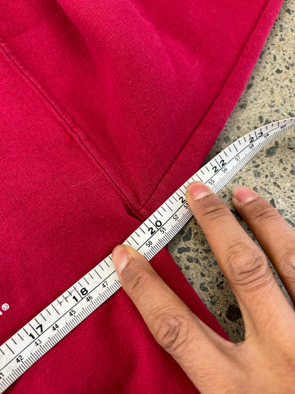 Vintage red crewneck sweatshirt features an Iowa State University graphic with the mascot Cy Medium