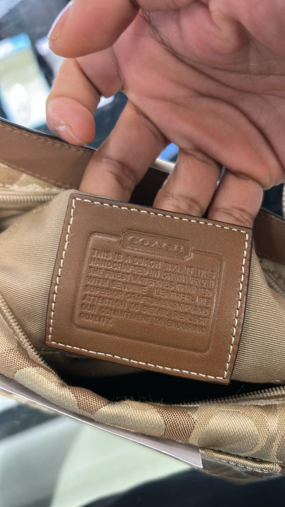 vintage Coach signature jacquard mini shoulder bag featuring the iconic brown "C" monogram pattern and a handy front pocket with a snap closure.