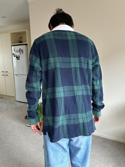 green and navy plaid shirt is the Stussy June Jacquard Rugby Shirt XL