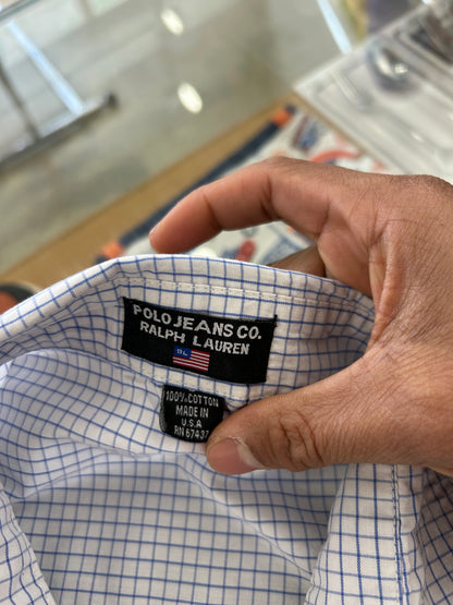 Vintage light blue and white grid-check (graph-check) short-sleeve button-down shirt by Polo Jeans Co. / Ralph Lauren featuring a small dark pony logo embroidered on the chest pocket.