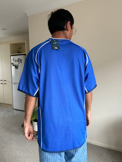 vibrant blue Umbro performance jersey featuring a V-neck design and white piping details XL