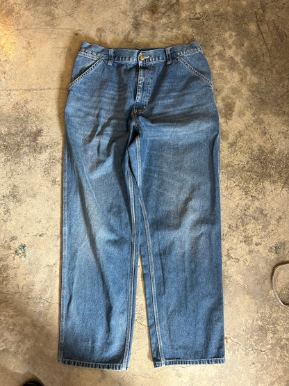 Carhartt WIP Simple Pants are rendered in a light blue stone-washed denim featuring the iconic square logo patch on the back pocket.Size 34