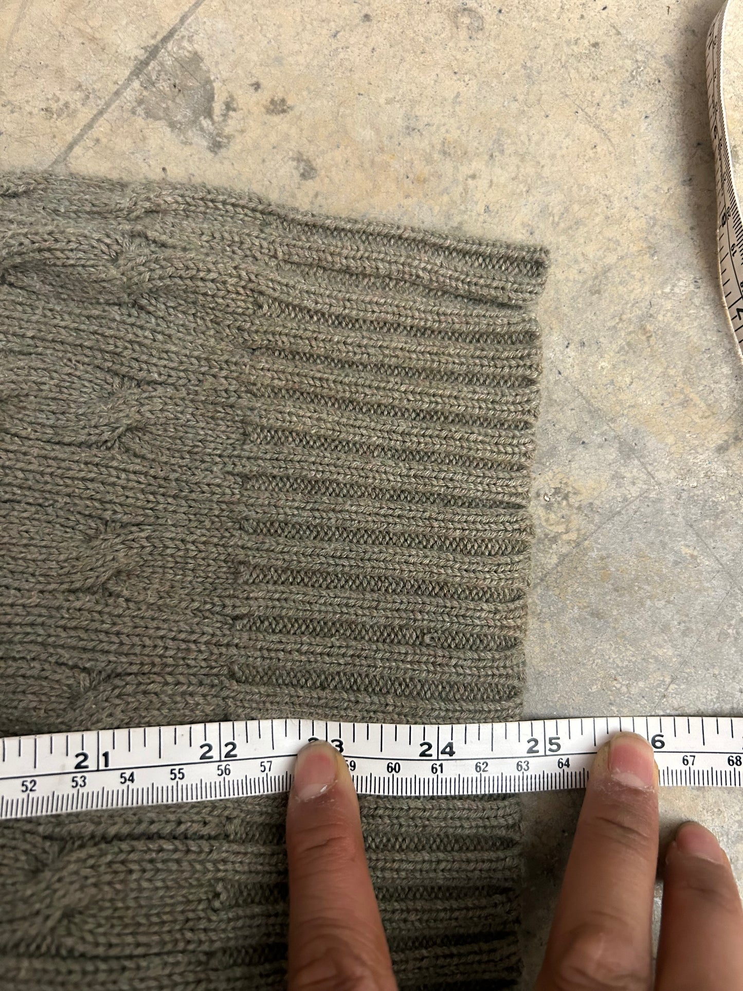 Vintage  Polo Ralph Lauren cable-knit V-neck sweater features a classic olive green textured weave and an embroidered signature pony logo