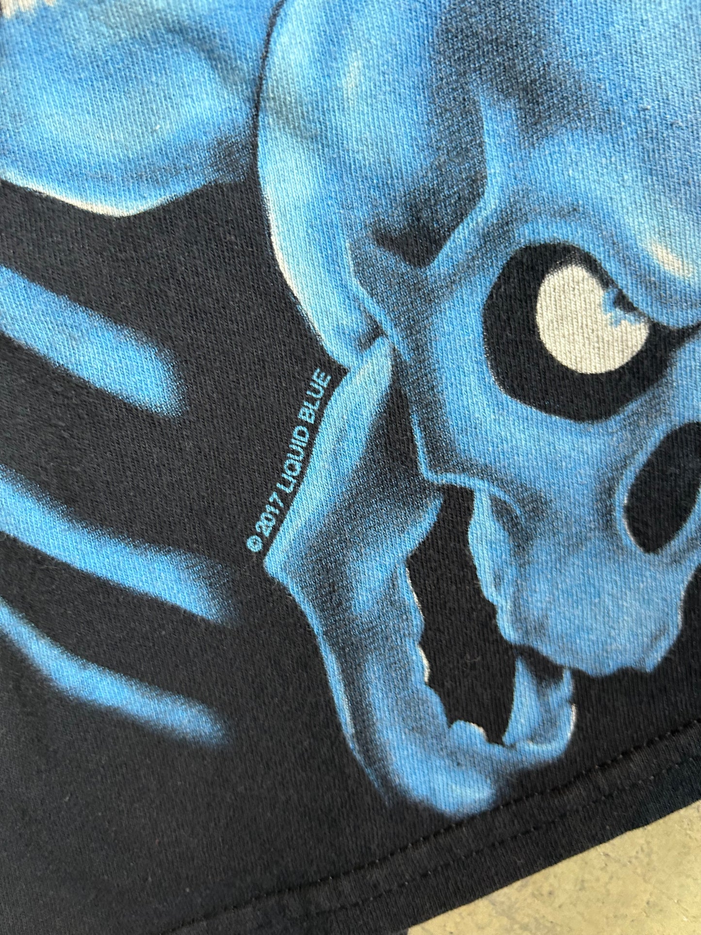 Liquid Blue "Skull Pile" t-shirt, known for its all-over print featuring blue skeletons XL Black 2017