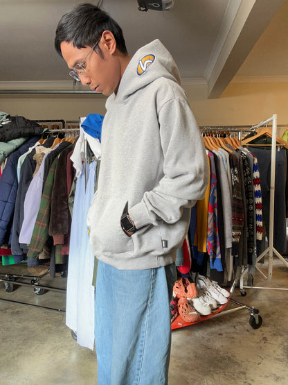 Lower hoodie featuring a distinctive yellow and blue logo patch on the hood and pocket Large Boxy