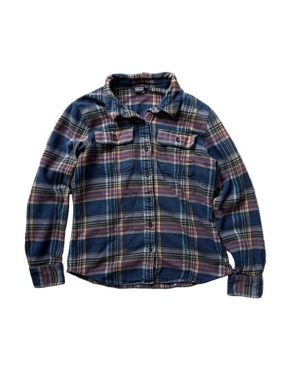Patagonia Women's Long-Sleeved Fjord Flannel Shirt in a blue and purple plaid pattern, made from 100% organic cotton