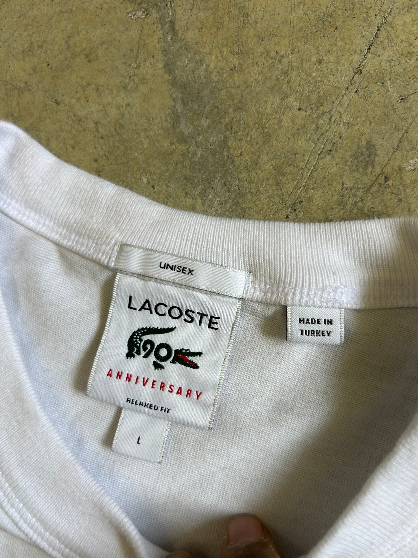 Lacoste 90th Anniversary Collector T-shirt, a limited edition piece designed to celebrate 90 years of the brand Large White