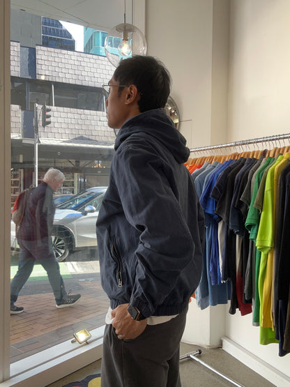 dark blue Polo Ralph Lauren hooded windbreaker features a distinctive red embroidered logo on the chest Navy Blue Large
