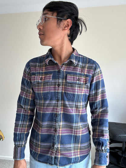 Patagonia Women's Long-Sleeved Fjord Flannel Shirt in a blue and purple plaid pattern, made from 100% organic cotton