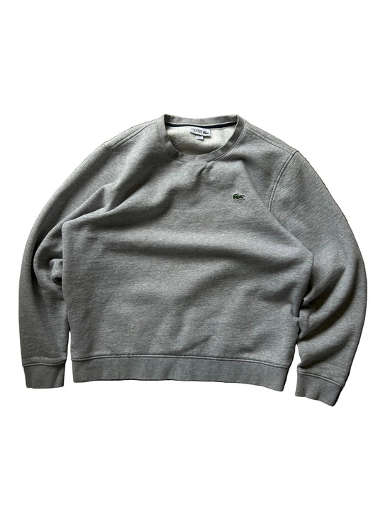 Lacoste grey crew neck sweatshirt, a classic staple from the brand known for its sporty yet stylish aesthetic. Large