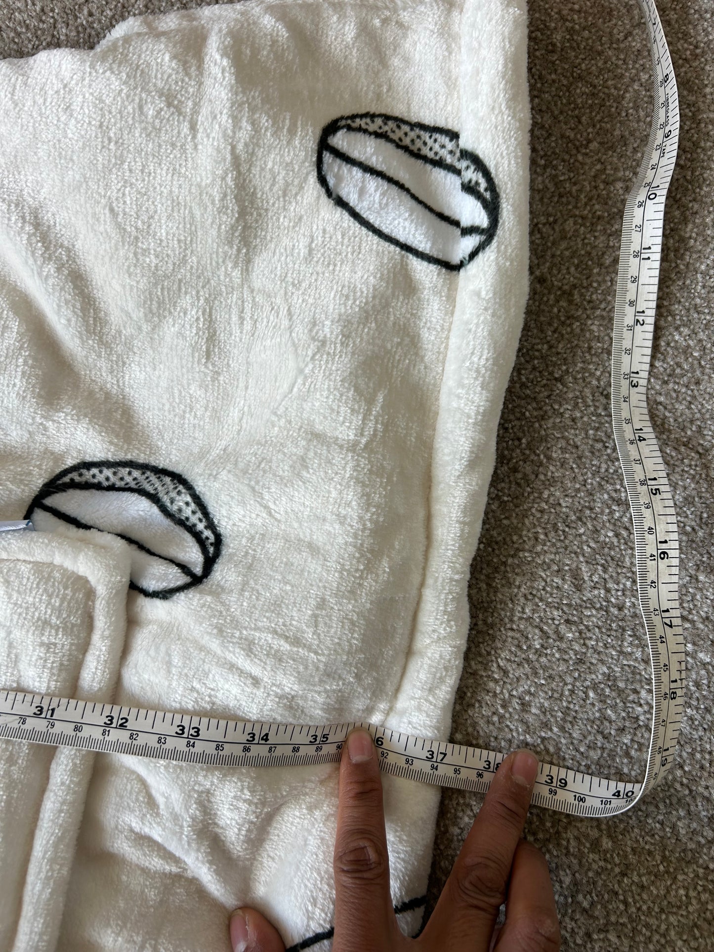 Jed's branded wearable blanket hoodie, "Oodie Cream