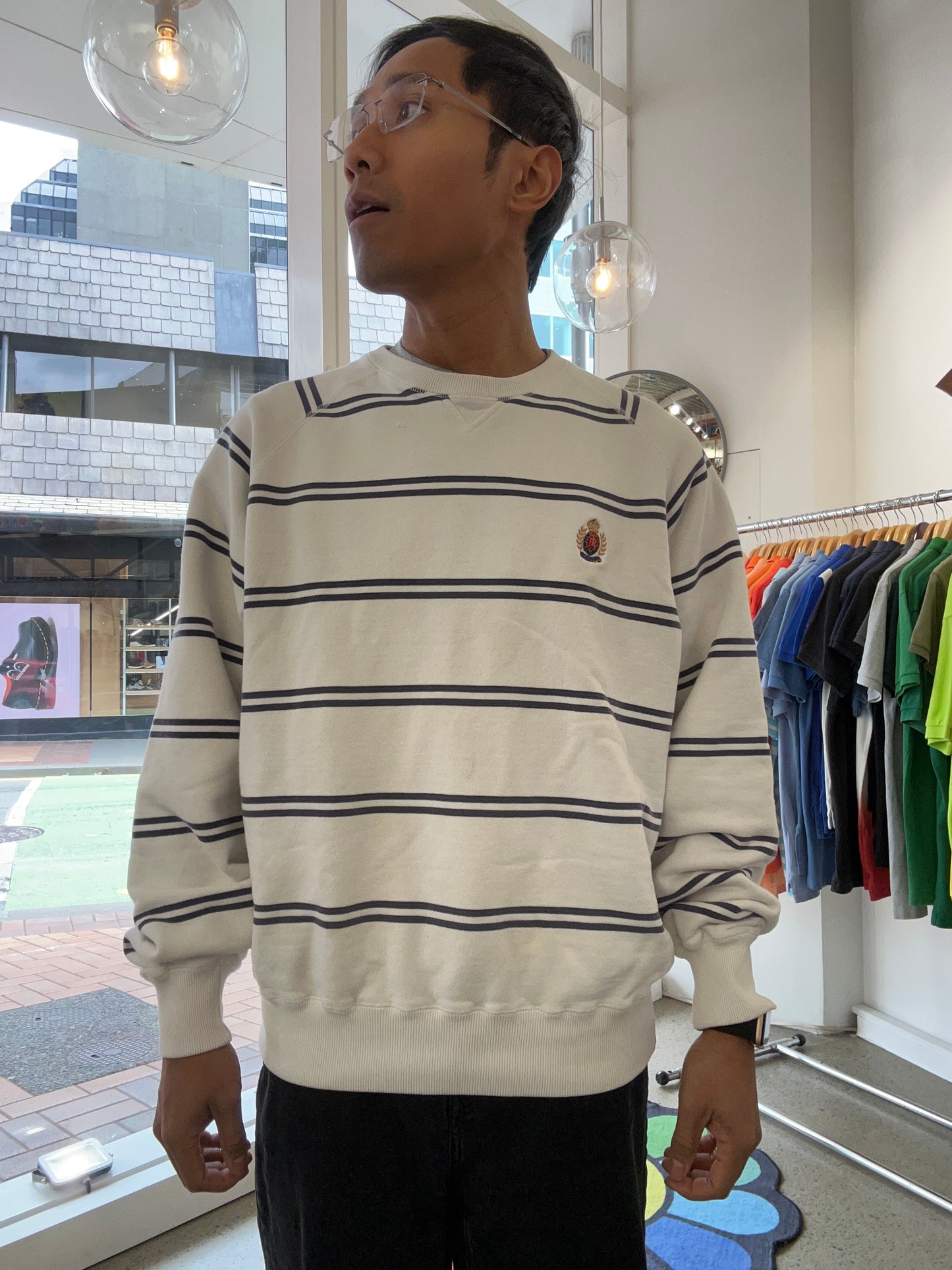 Vintage Polo Ralph Lauren striped crew neck sweater features a white base with navy horizontal stripes and an embroidered crest on the chest.