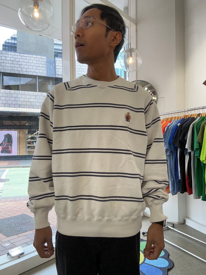Vintage Polo Ralph Lauren striped crew neck sweater features a white base with navy horizontal stripes and an embroidered crest on the chest.