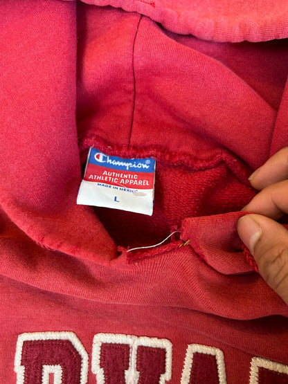 Vintage Fade red Champion hoodie features a prominent arched "HARVARD" spellout graphic and a comfortable kangaroo pocket Large