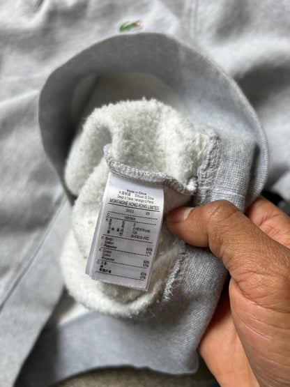Lacoste grey crew neck sweatshirt, a classic staple from the brand known for its sporty yet stylish aesthetic. Large