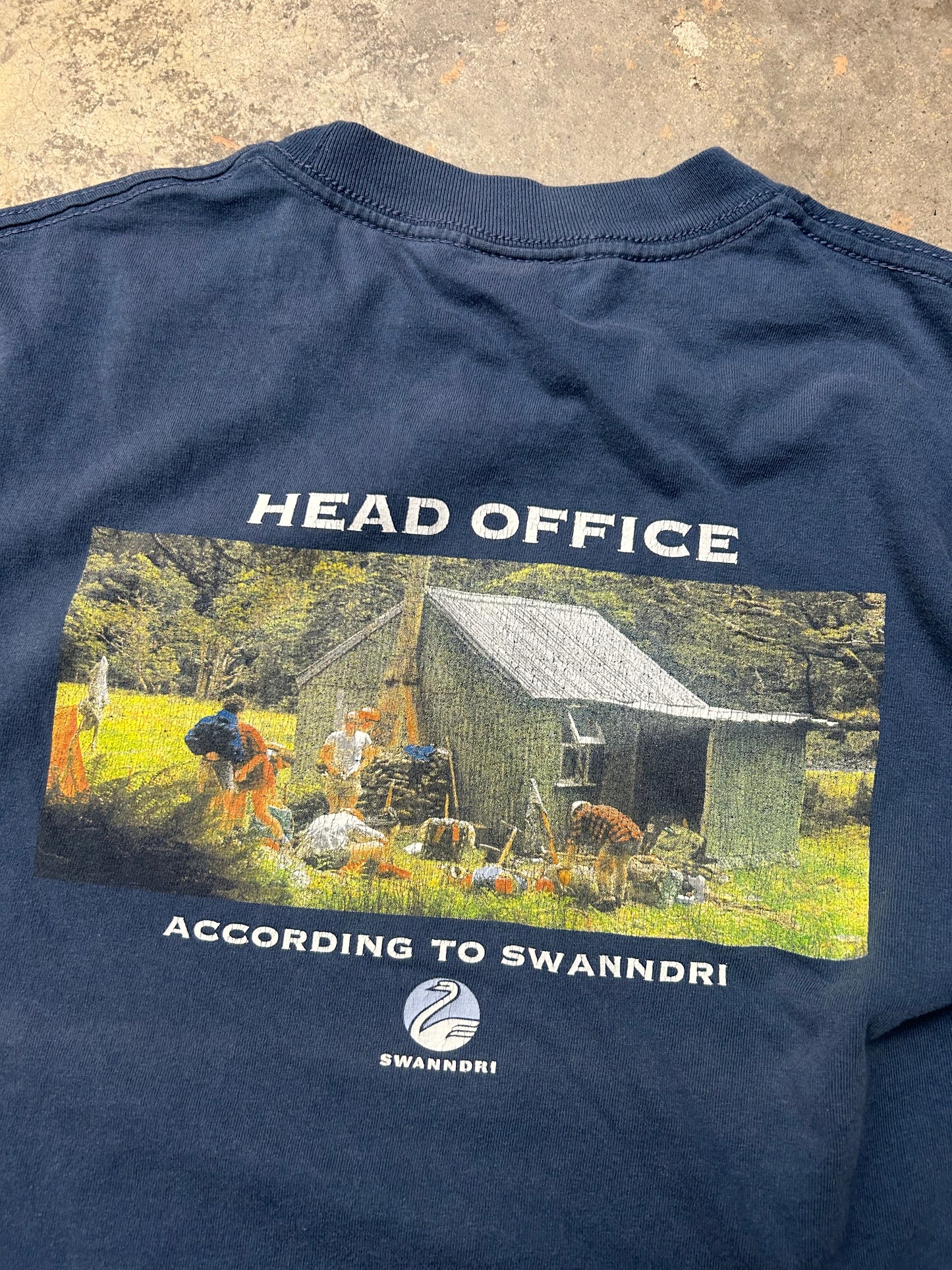 Vintage blue Swanndri t-shirt features a "Head Office" graphic print on the back Large
