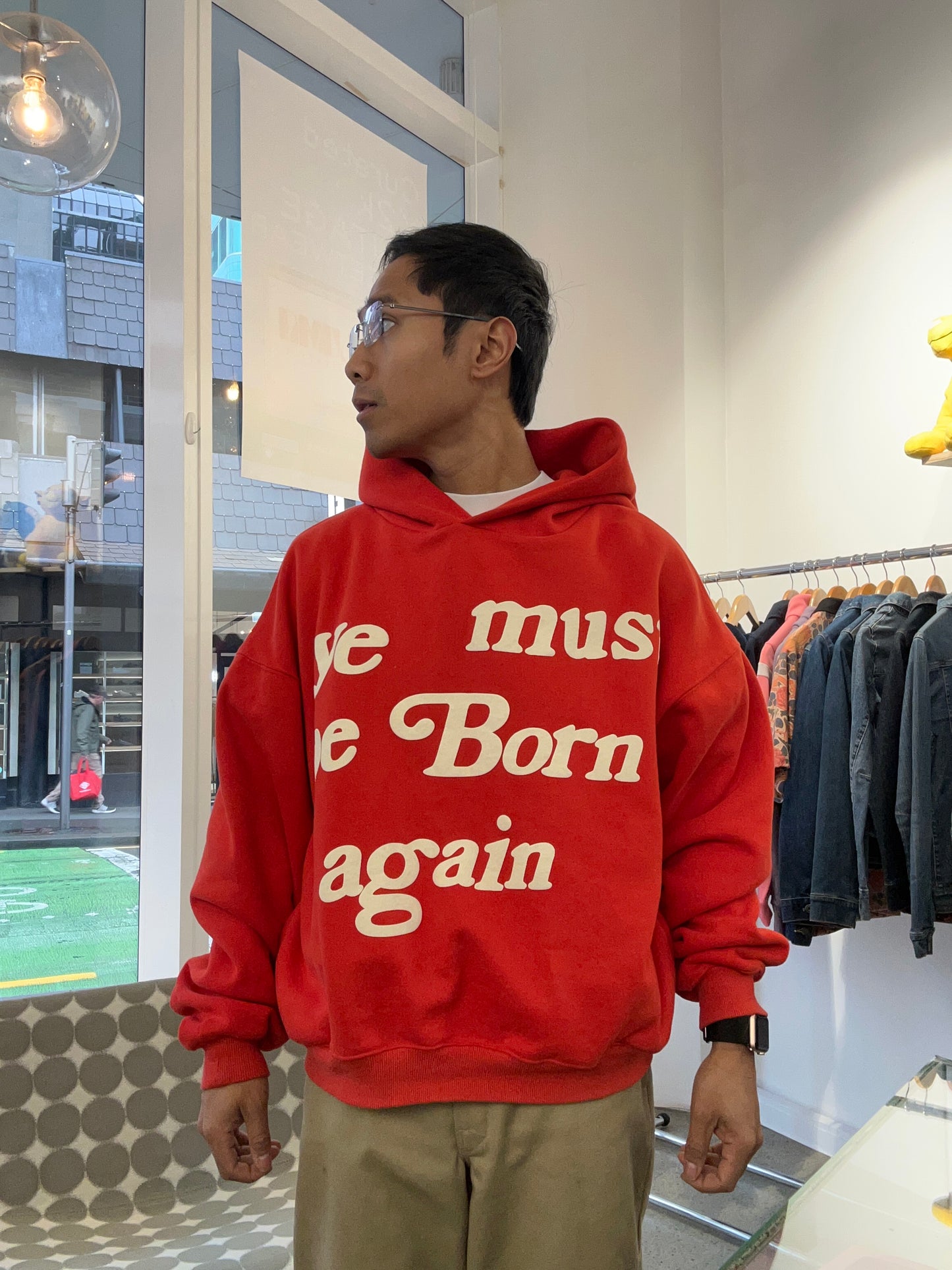 red Cactus Plant Flea Market (CPFM) "Ye Must Be Born Again" hoodie featuring prominent white puff-print lettering across the chest. Medium