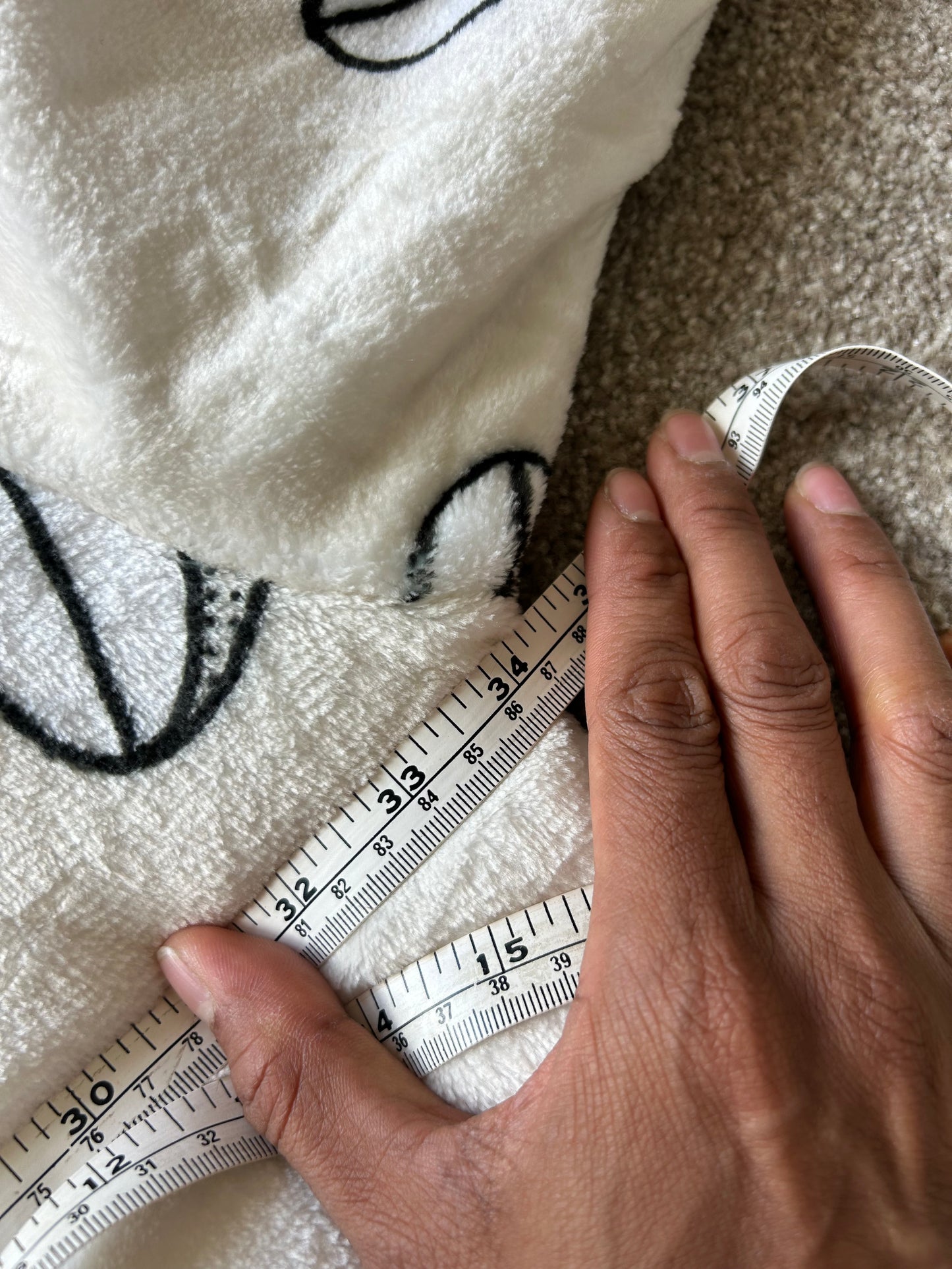 Jed's branded wearable blanket hoodie, "Oodie Cream