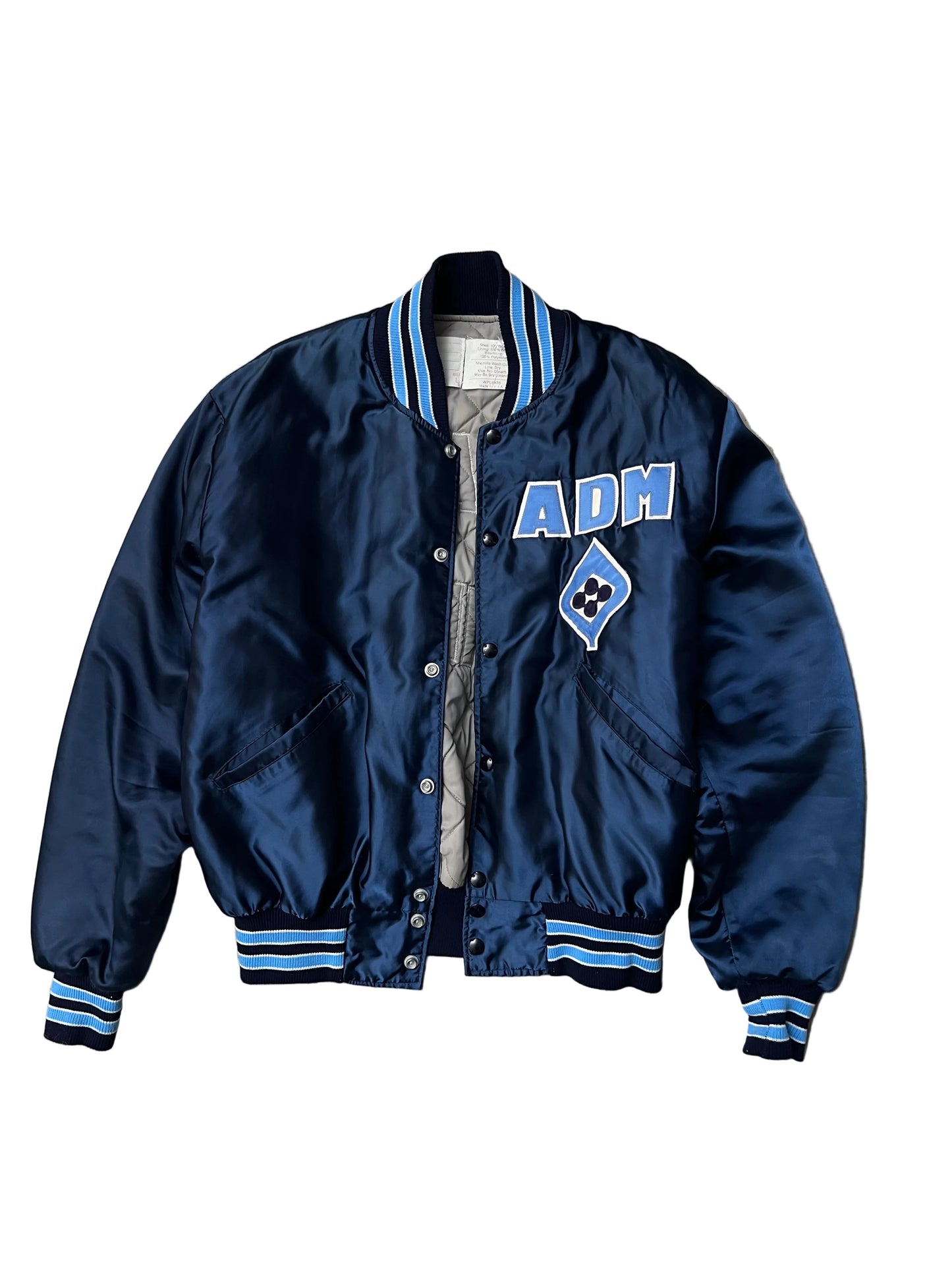 Vintage blue satin varsity bomber jacket features "Decatur Illinois" embroidered on the back in a light blue and white block font Large