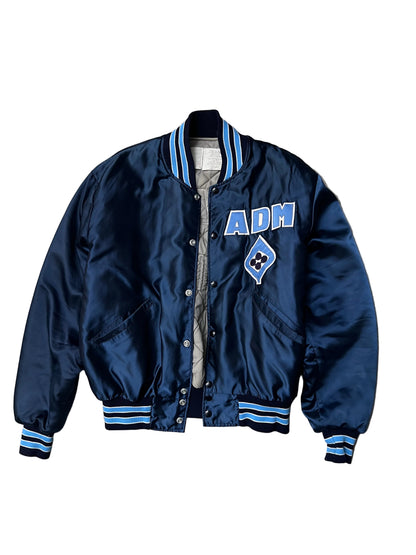 Vintage blue satin varsity bomber jacket features "Decatur Illinois" embroidered on the back in a light blue and white block font Large